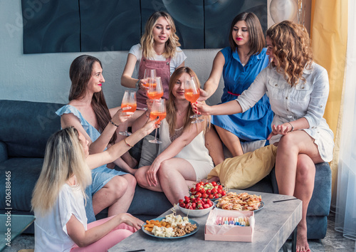 Girls Party. Beautiful Women Friends Having Fun At Bachelorette Party. They are Celebrating And Drinking Champagne At Hen Party. They are talking © Igor Kardasov