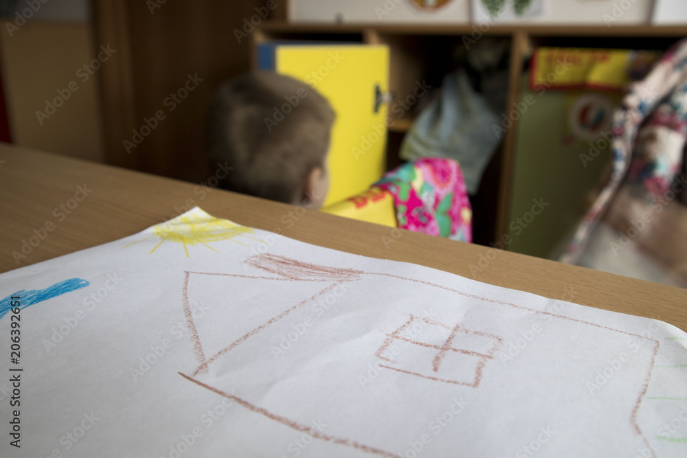 children's drawing on a background of multicolored wardrobes dressing up in kindergarten, elementary school children's drawing on a background of multicolored wardrobes dressing up in kindergarten, elementary school