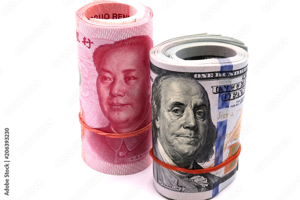 US dollar bill and Chaina yuan banknote macro white background. US dollar bill and Chaina yuan banknote macro white background.