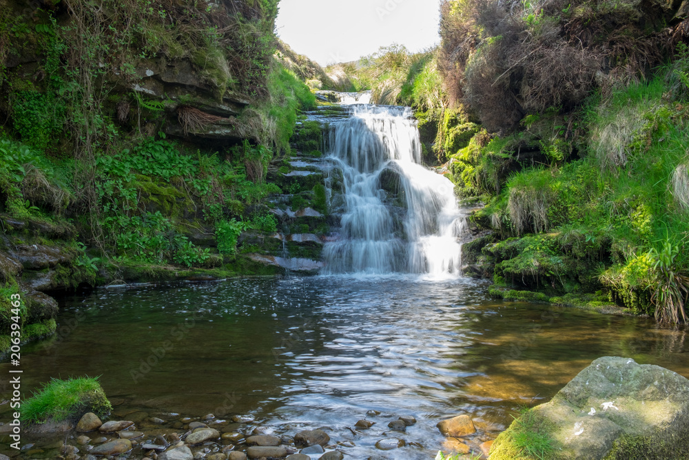 Obraz premium Cascading waterfall in the Peak District England