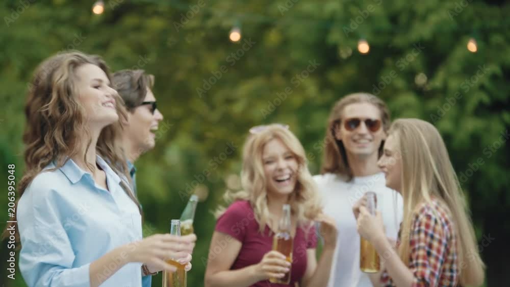 Beautiful Girl Dancing With Friends At Outdoor Party. Beautiful Girl Dancing With Friends At Outdoor Party.