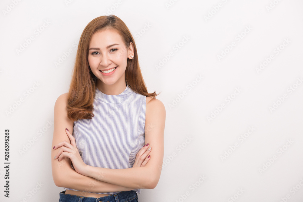 Smiling woman with crossed arms. Portrait isolated on white background. Smiling woman with crossed arms. Portrait isolated on white background.