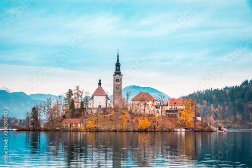 Photography View of Bled Lake during Autumn with Bled Castle and snow and mountains in backg
