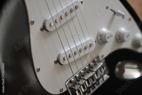 Slika na platnu Closeup of pickups on white six string electric