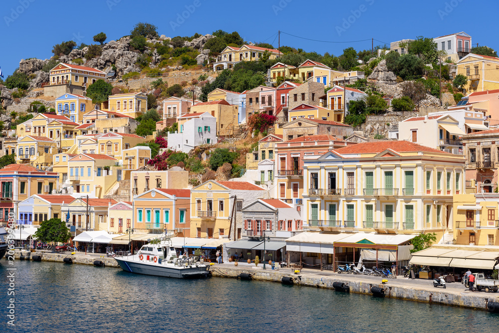 Colorful houses on the hillside of the island of symi. Greece