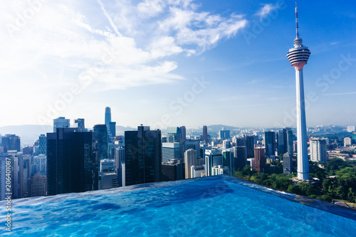 Canvas Print Swimming pool on rooftop with beautiful cityscape of Kuala lumpur