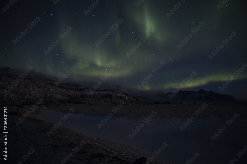 Northern Lights in Icelandic nocturnal landscape