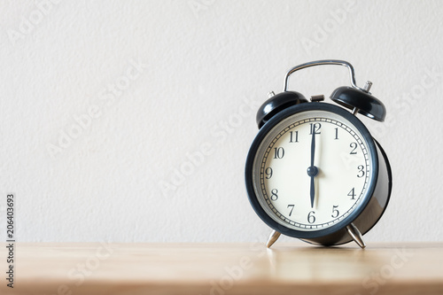 Wallpaper Mural Black circle alarm clock  put on the wood table Torontodigital.ca