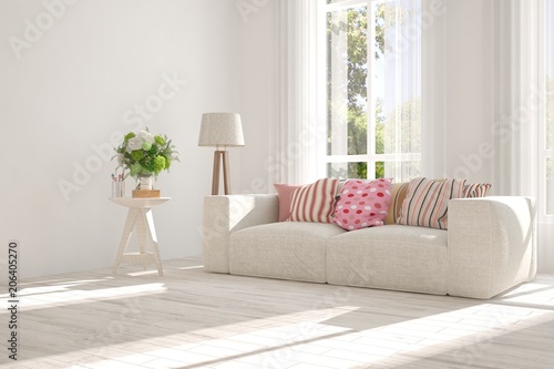 Idea of white room with sofa and summer landscape in window. Scandinavian interior design. 3D illustration © AntonSh