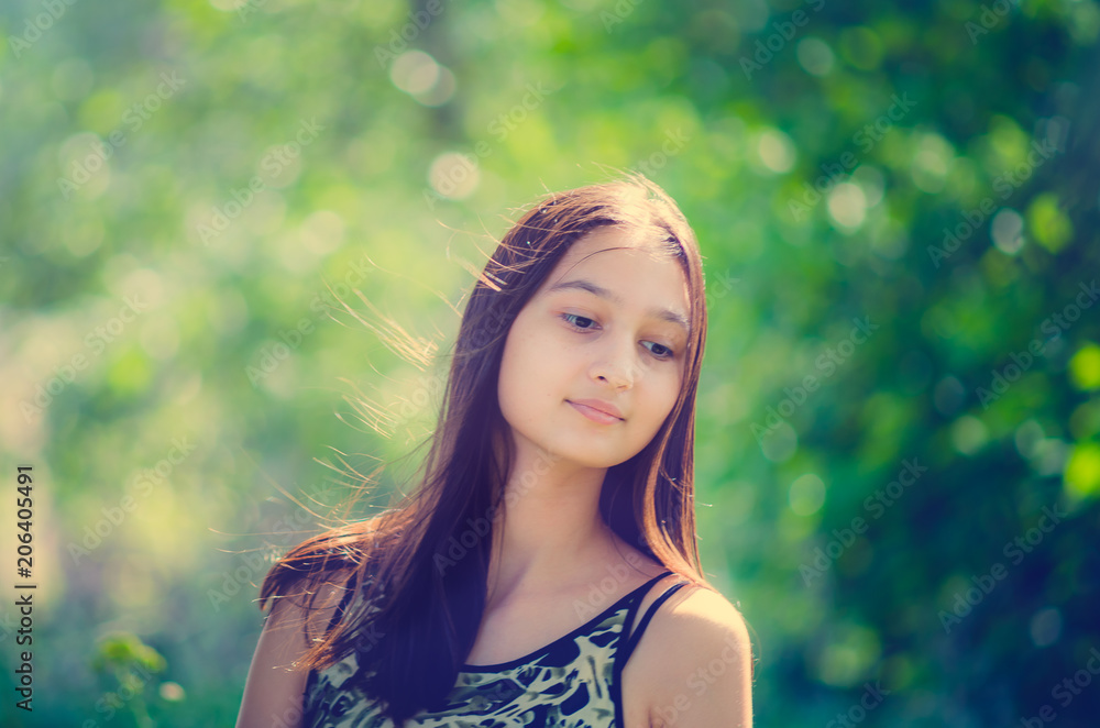 Portrait of a beautiful young girl with long hair. Toning in the style of instagram. Portrait of a beautiful young girl with long hair. Toning in the style of instagram.