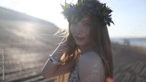 Young beautiful woman walking on the beach