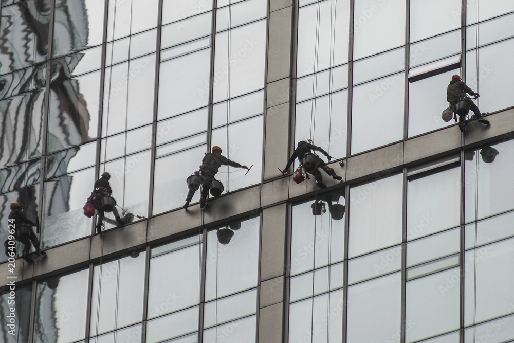 custom made wallpaper toronto digitalMoscow, Russia - May, 18, 2018: Steeplejacks work on a wall of Moscow city building
