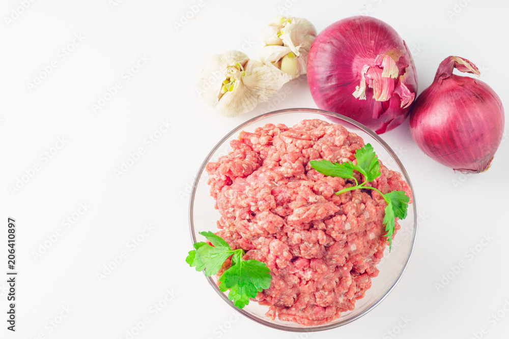 Raw minced meat in a plate on white background Raw minced meat in a plate on white background