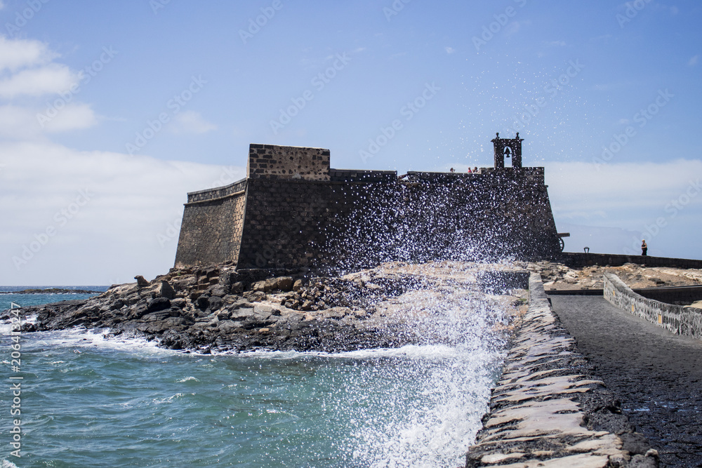 Spanish fortressof Lanzarote at rough sea