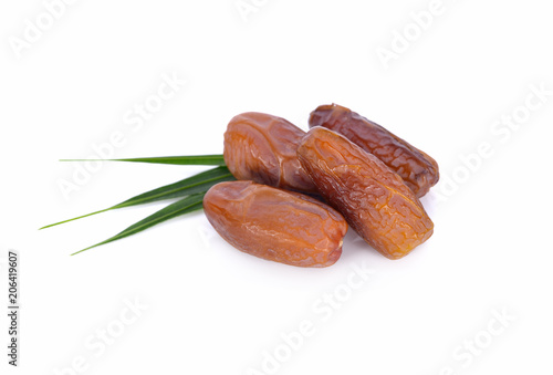 date palm fruit with leaf on white background