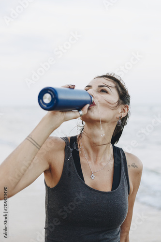 Woman drinking water after a workout