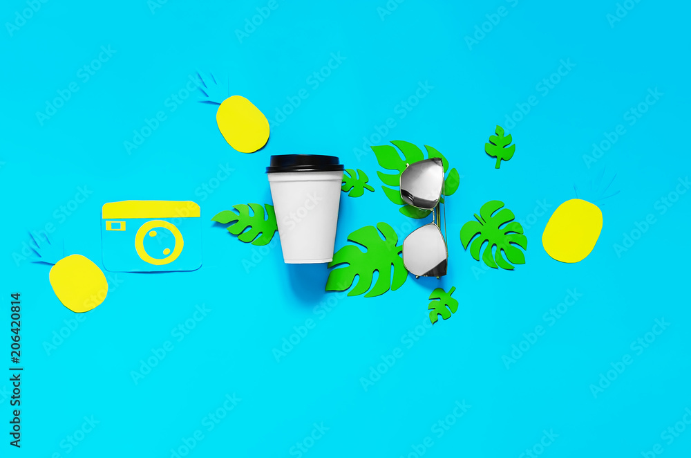 Ice Cocktail in summer weather. view from above. blue background. tropical leaves, glasses, camera. fruit Ice Cocktail in summer weather. view from above. blue background. tropical leaves, glasses, camera. fruit