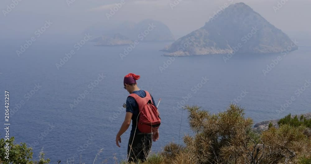 Traveller walking down the hill Traveller walking down the hill
