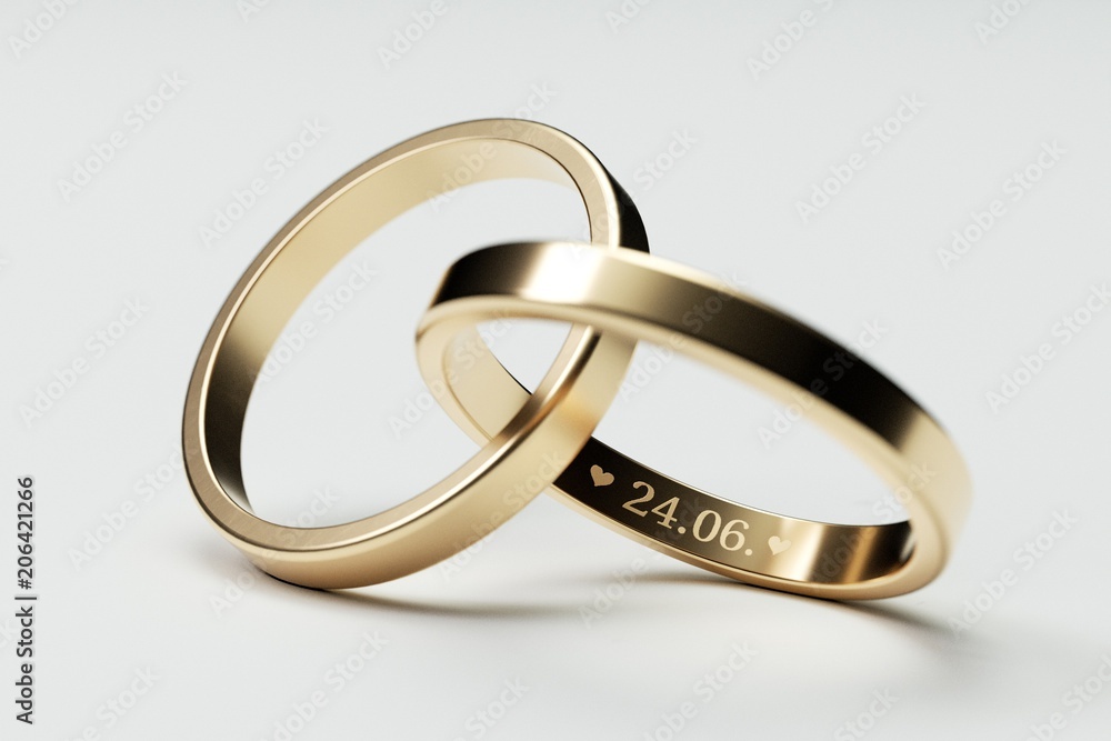 Isolated golden wedding rings with date 24. June Isolated golden wedding rings with date 24. June