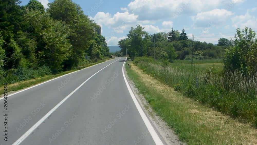 Car moving on a country side road highway, with moving traffic seen Car moving on a country side road highway, with moving traffic seen