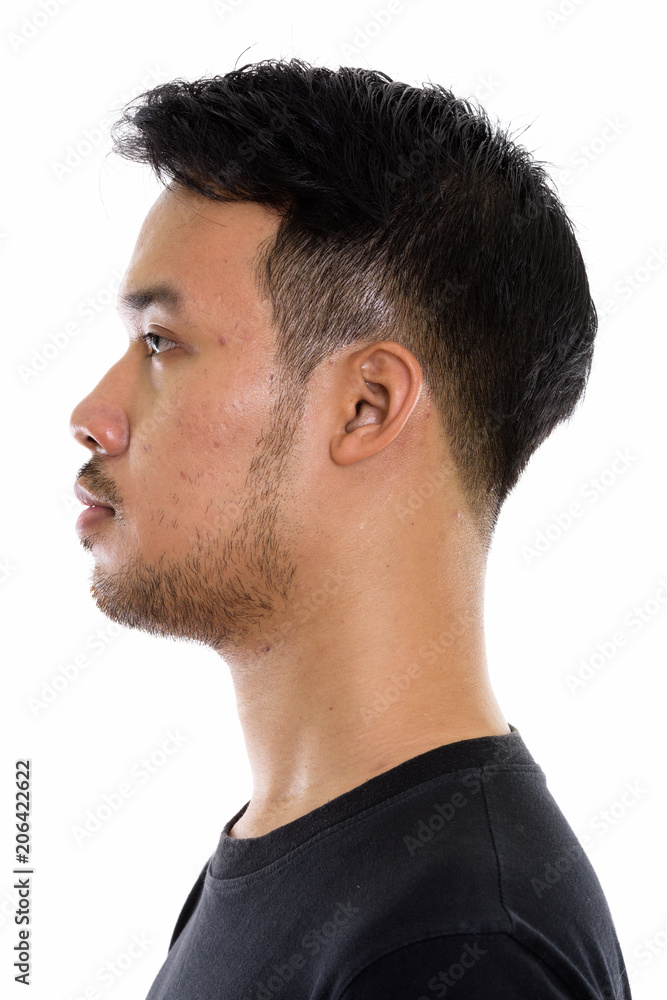 Fototapeta premium Profile view of face of young Asian man 