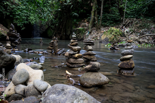 Stacks of rocks in a river near Goa Rang Reng waterfall near Ubud, Bali, Indonesia (12.05.2018)