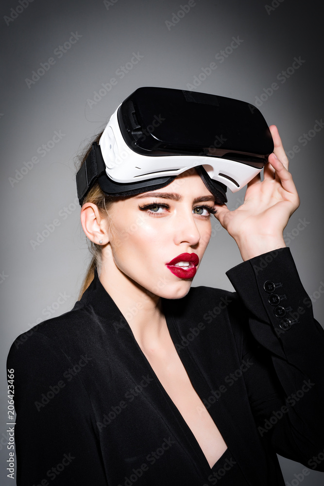 Beauty girl with VR headset. Charming sexy woman with virtual glasses on head. Attractive sensual girl with perfect makeup, red with VR device. 3d goggles, entertainment, virtual reality. foto de
