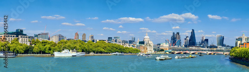 London, panoramic view over Thames river with London skyline on a bright day in Spring.