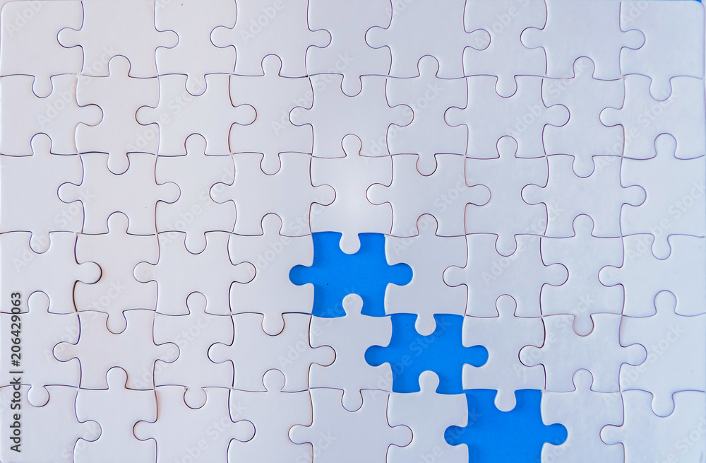 Jigsaw with one piece missing revealing Jigsaw with one piece missing revealing