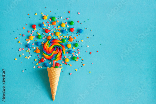 Ice cream cone with colorful lollipop and multicolored sweets. concept, , flat lay,  top view, copy space,