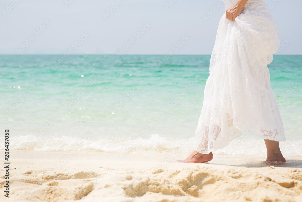 a beautiful carefree Woman relaxing at the beach enjoying her sun dress freedom wear. a beautiful carefree Woman relaxing at the beach enjoying her sun dress freedom wear.