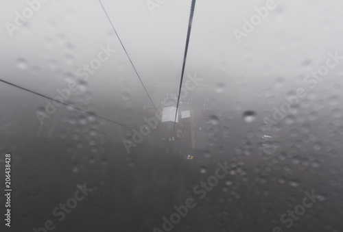 A gondola cuts its way through the mist and fog