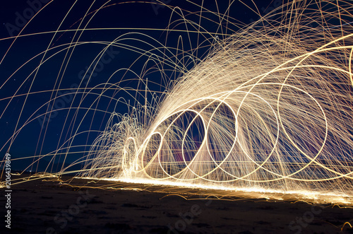 The art of the spinning steel wool making beauty in the night sky. 