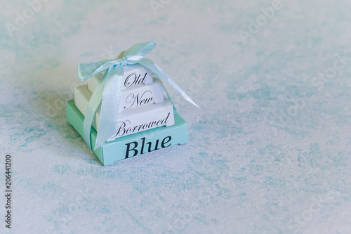 Blue wedding background. Wedding tradition : something old, new, borrowed and  blue. Sky blue background with copy space for text. Blank stationary template / invitation mockup.