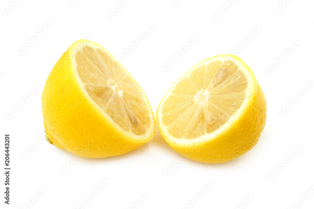 Two halves of lemon on white background