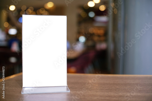 Menu frame standing on wood table in Bar restaurant cafe. space for text marketing promotion.