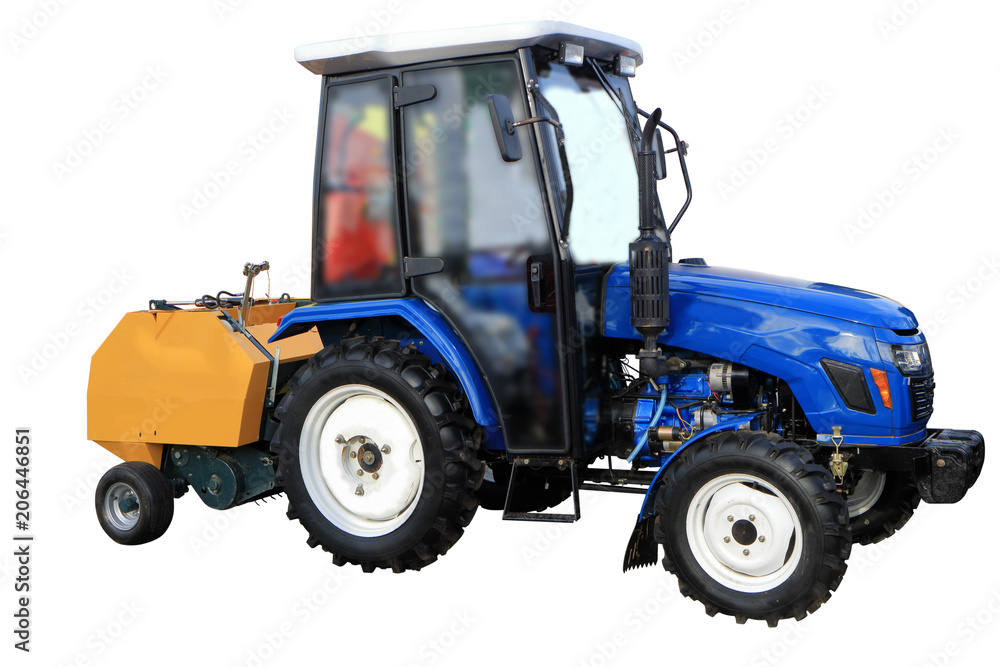 Obraz premium Tractor with a trailer for processing hay.