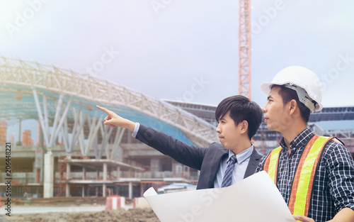 Group of engineer people working on construction site