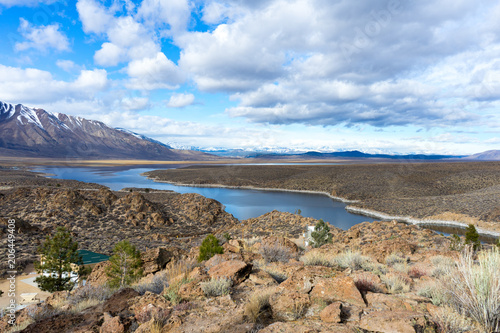Schilderij op canvas Partly cloudy over Crowley Lake in California