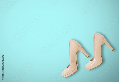 Fashion female pink shoes with heels. Women's footwear casual design isolated on blue background with free space for text.