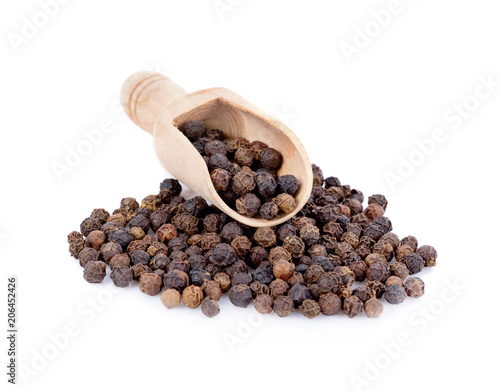 coriander seed in wooden scoop isolated on white background