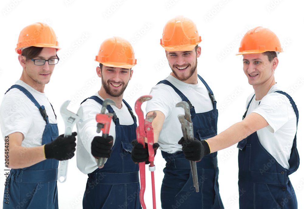 group of plumbers with working tools group of plumbers with working tools
