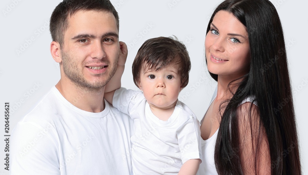 Happy family with newborn baby on a white background.