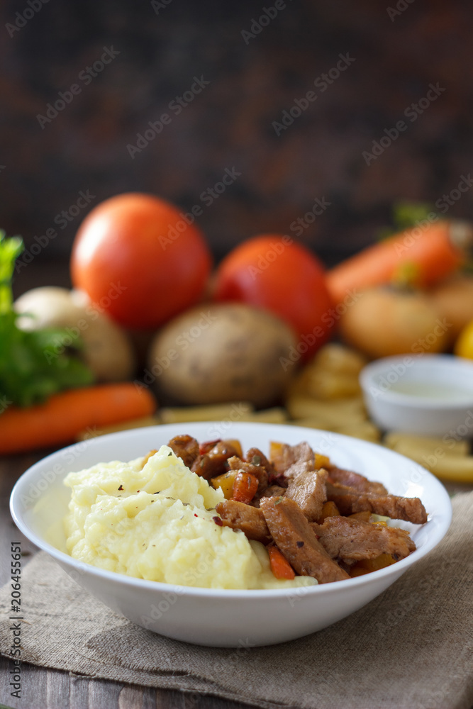 Soy meat with potato puree over kitchen table. Soy meat with potato puree over kitchen table.
