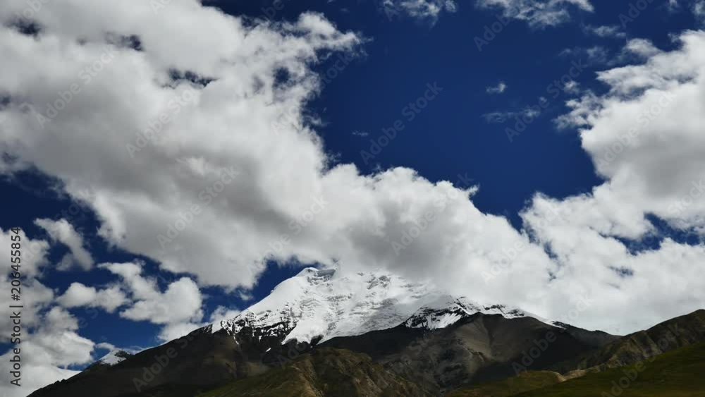 Snowcapped peak and blue sky with clouds in the Himalaya mountains Tibet Snowcapped peak and blue sky with clouds in the Himalaya mountains Tibet