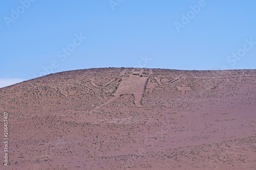 Giant Of The Atacama, Gigante De Tarapaca, large petroglyph on a rocky outcrop in the Atacama Desert, Tarapaca Region, northern Chile, South America photo