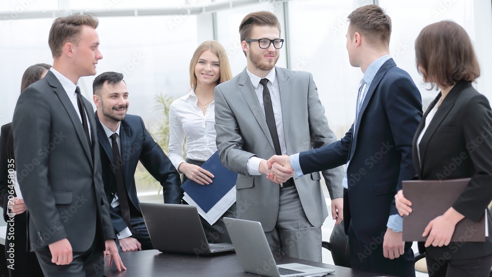 handshake business partners at a meeting in the office handshake business partners at a meeting in the office