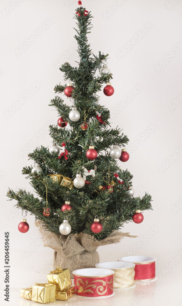 Decorated Christmas Tree, silk ribbons and golden parcels
