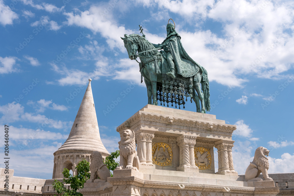 St. Stephen monument in front of Matthias Church at Buda Castle in Budapest, Hungary. Gothic cathedral church. St. Stephen monument in front of Matthias Church at Buda Castle in Budapest, Hungary. Gothic cathedral church.