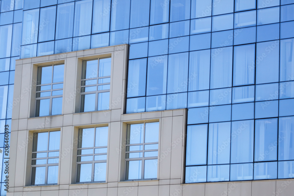 Blue glass windows on the house as a background Blue glass windows on the house as a background